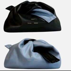 Merit x Proenza
Schouler bag - Reversable Vegan Leather Clutch Cosmetic Bag